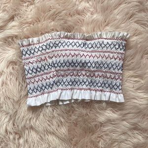 Women’s red white and blue bando swim top. A few loose seam. Size Medium.